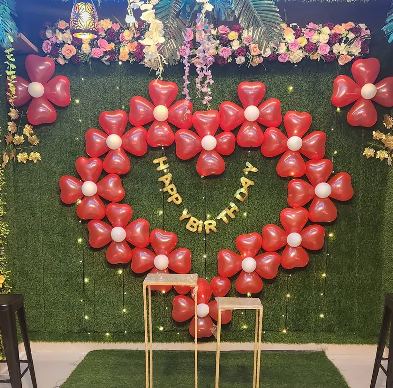 Red heart-shaped balloon backdrop at JD Party Box