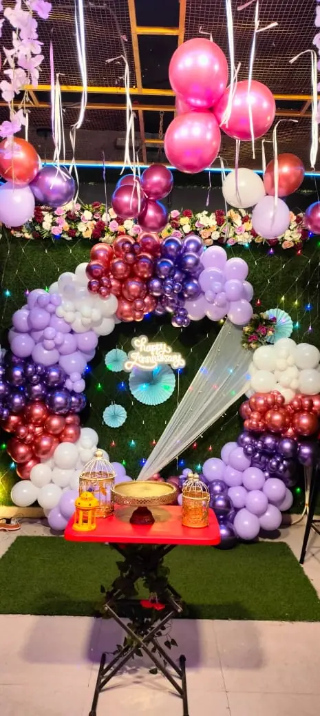 Lavender and rose gold ring balloon arch with anniversary setup at JD Party Box, Rajahmundry